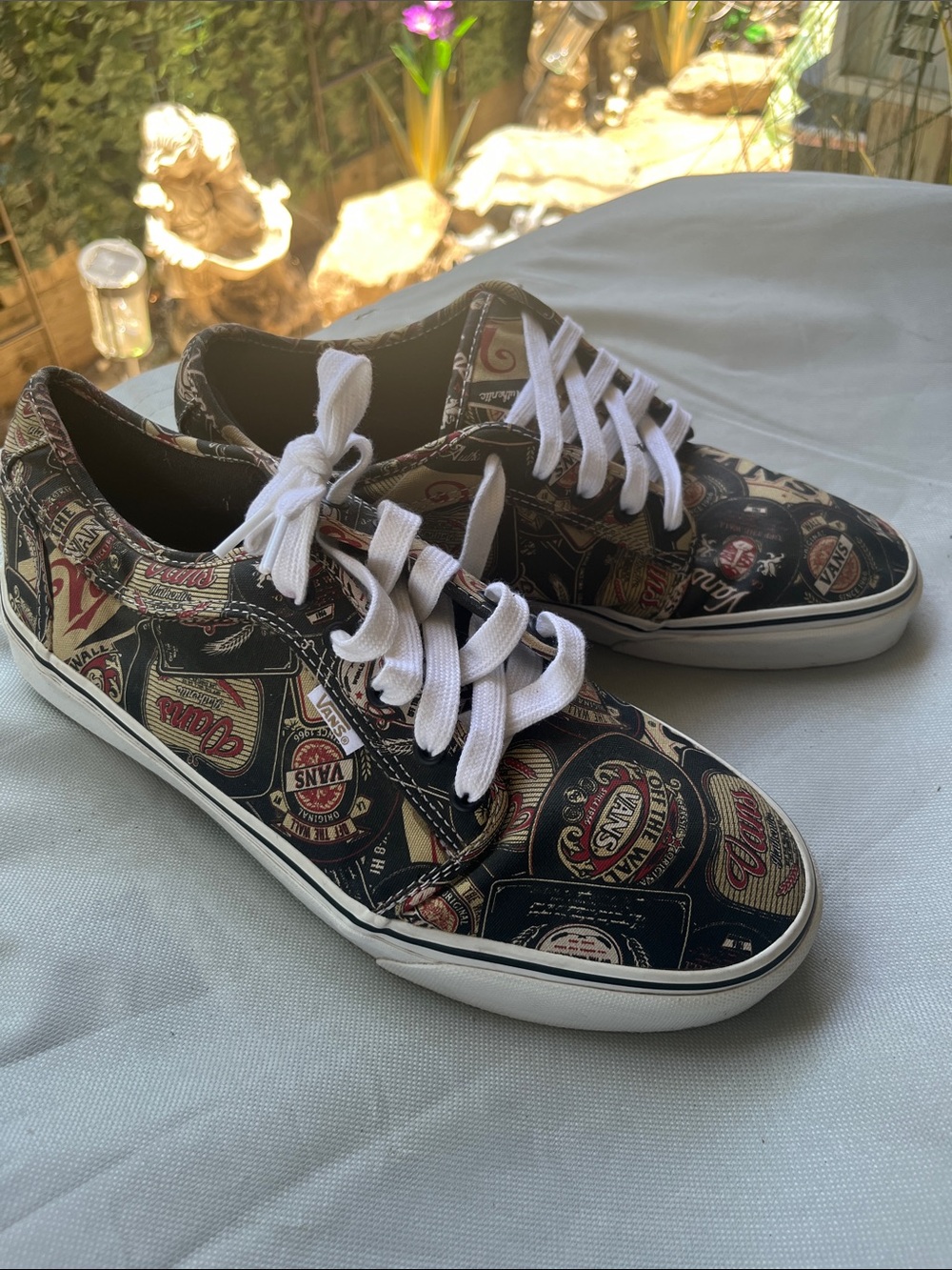 Vans Low-Top Sneakers in Black with White Laces and Multi-Label Print